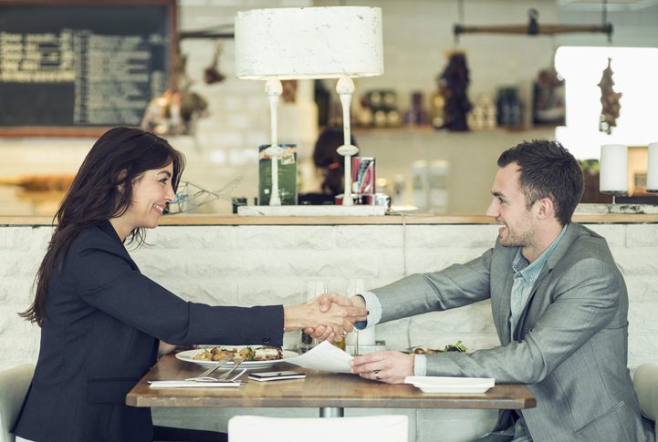 Martinson & Carter, CPAs, PA | couple meeting over lunch at a restaurant going over paperwork